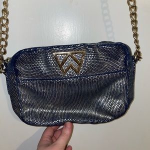 Kelly Wynn’s Dark Blue and Gold Purse
